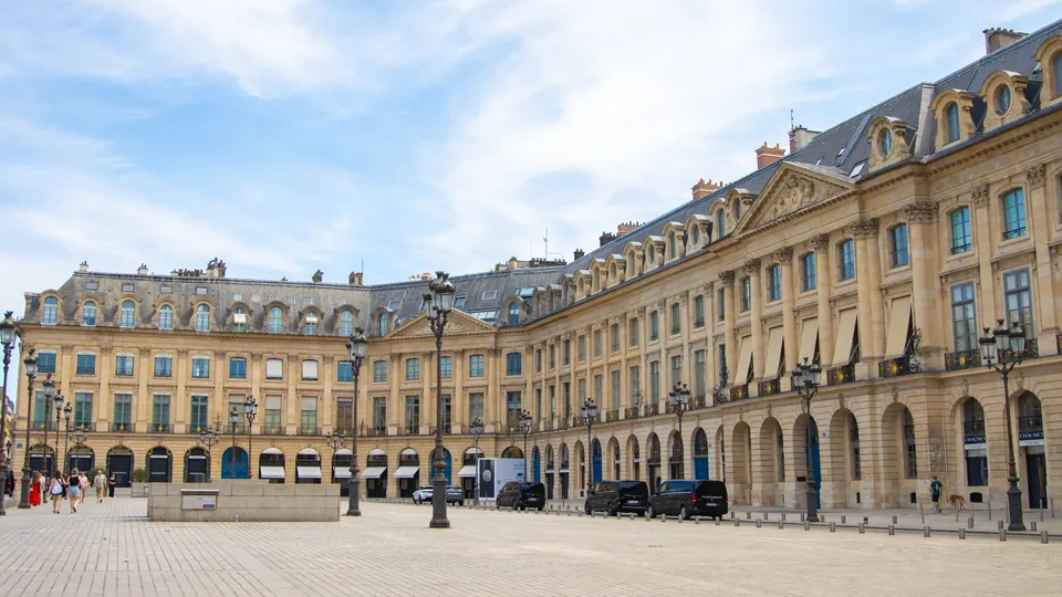 Classical stone facades of Place Vendôme in Paris under a blue sky